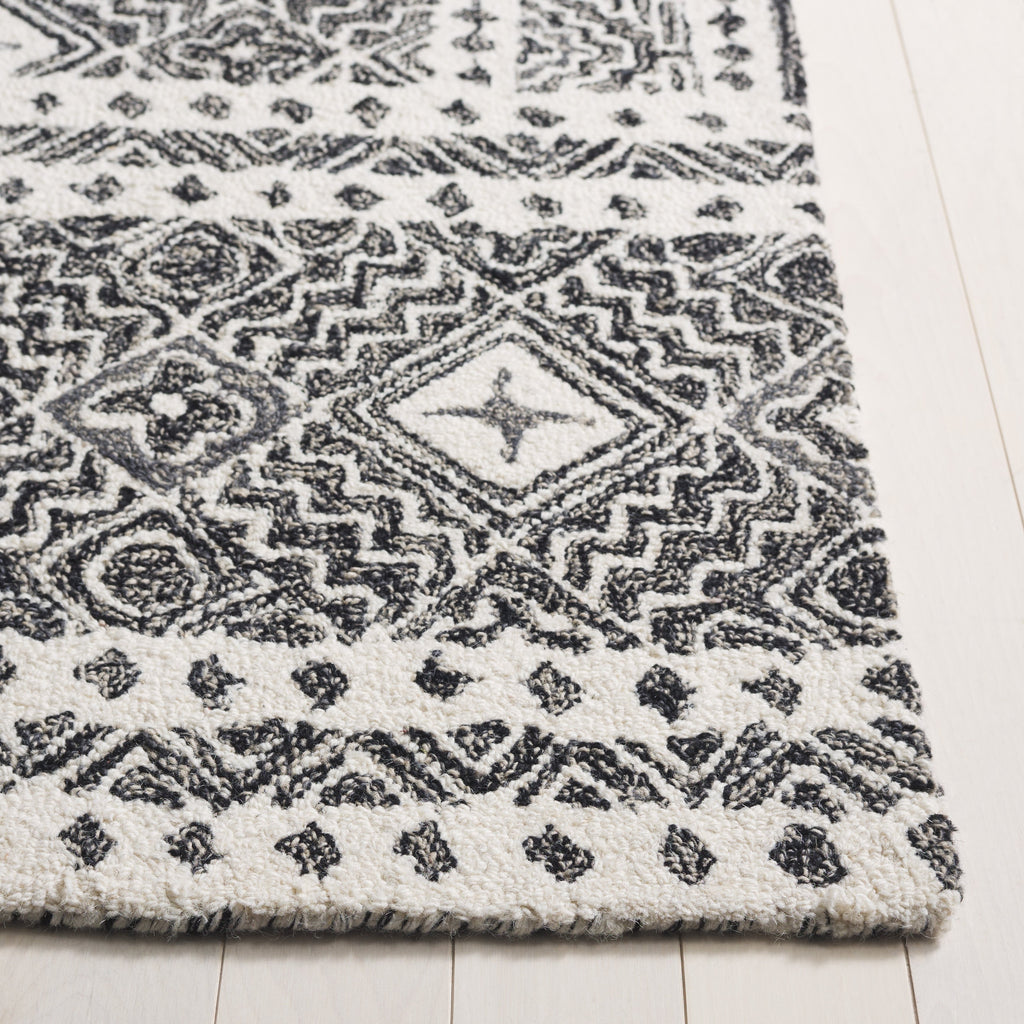 SAFAVIEH Handmade Micro-Loop Lutetia Wool Rug