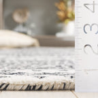 SAFAVIEH Handmade Micro-Loop Lutetia Wool Rug